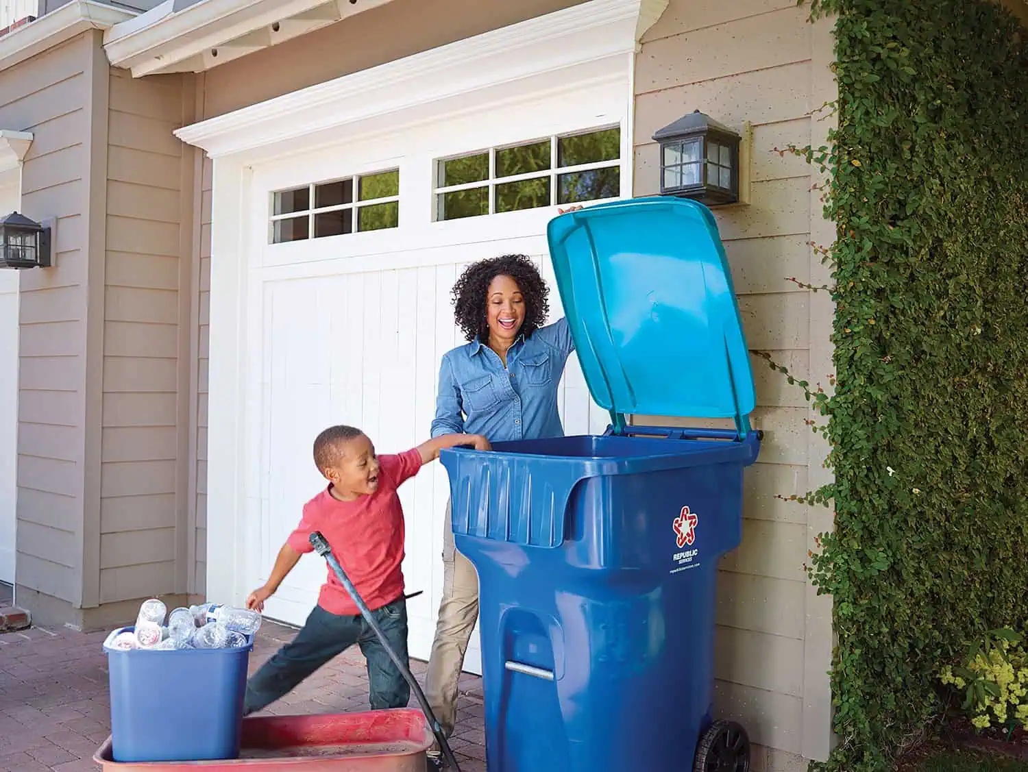 Woman and child recycling at home.