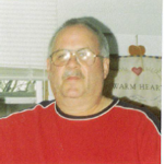 Man with glasses wearing a red shirt