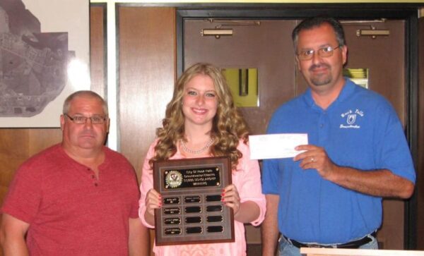 Presentation of an award and check ceremony.